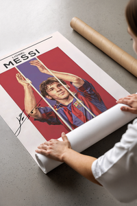 Person unrolling a Lionel Messi Barcelona Portrait poster on concrete floor.