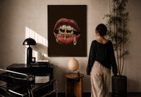 Lips with a Cross and Grillz print in a black frame on a sunlit plaster wall, a woman looking on beside a mushroom lamp