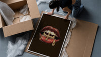 Lips with a Cross and Grillz framed print being unpacked from protective bubble wrap and a box