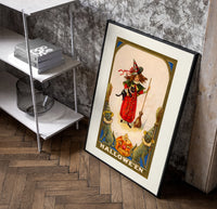 Girl witch holding black cat poster in a black frame leaning beside a shelf in a raw-plaster loft