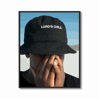 Framed Lord's Child Bucket Hat print shown as a bold statement piece on a clean gallery wall