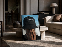 Lord's Child Bucket Hat print on the floor, leaning against a travertine table