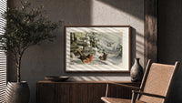 Robin, wrens and tit in snow print in a wood frame above a fluted sideboard beside an olive tree