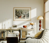 Robin, wrens and tit in snow print in an oak frame above a mid-century book console with a vintage radio