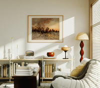 Winter landscape with ice skaters at dusk print in an oak frame above a mid-century book console with a vintage radio