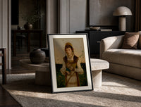 Young woman holding roses and book print in a black frame leaning on a travertine table in a sunlit lounge