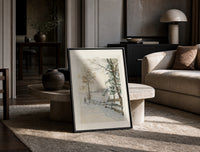 Hunter and dog in snowy landscape print in a black frame leaning on a travertine table in a sunlit lounge