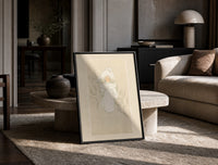 Child in white winter coat and bonnet print in a black frame leaning on a travertine table in a sunlit lounge