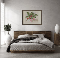 Holly sprig with red berries print in a dark wood frame above a rattan bed on a plaster wall