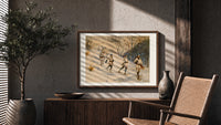 Snowshoers in winter forest print in a walnut frame above a fluted sideboard and cane chair