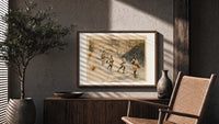 Snowshoers in winter forest print in a wood frame above a fluted sideboard beside an olive tree