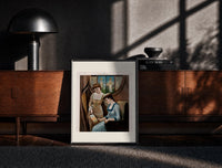 Black-framed Two Victorian women looking at painting print on a moody console with designer coffee-table books