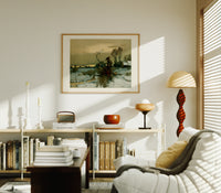 Winter landscape with bare trees print in an oak frame above a mid-century book console with a vintage radio