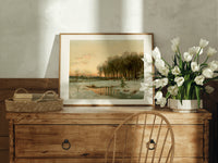 Winter landscape with frozen stream print in an oak frame on a farmhouse dresser beside white tulips