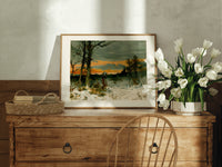 Woman walking through snowy winter landscape print in an oak frame on a farmhouse dresser beside white tulips