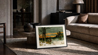 Woman walking through snowy winter landscape print in a slim black frame leaning on a travertine coffee table
