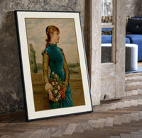 Victorian woman holding flower basket print in a black frame leaning beside a vintage door on parquet