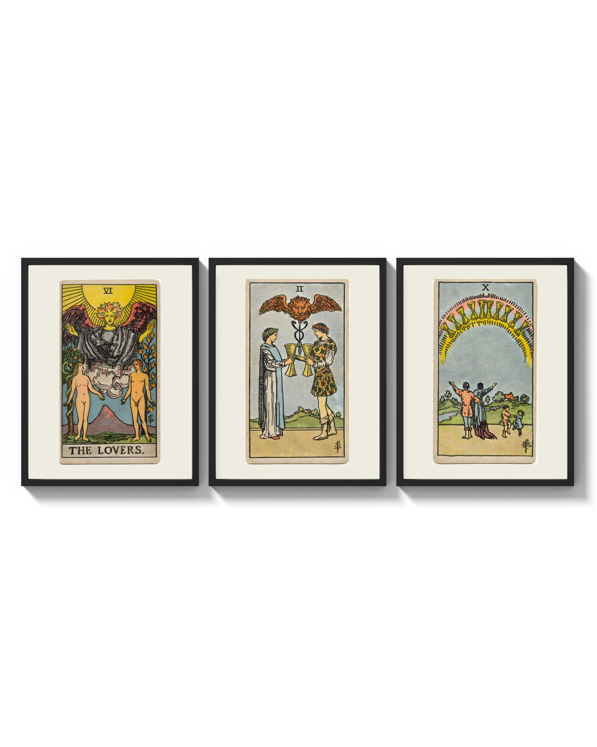 Three Rider-Waite tarot cards arranged on a bright gallery wall
