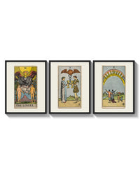 Three Rider-Waite tarot cards arranged on a bright gallery wall