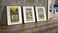 Three Rider-Waite tarot cards three-piece set leaning on parquet beside a vintage loft door