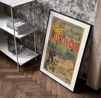 Man on horse at festival poster in a black frame leaning beside a shelf in a raw-plaster loft