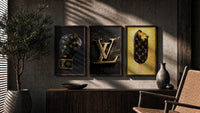 Louis Vuitton Pop Art Poster Set triptych in three walnut frames above a sideboard in a warm room