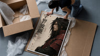 Anime warrior in red armor framed print being unpacked from protective bubble wrap and a box