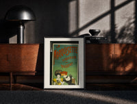 Black-framed Two elegant women tasting liqueur print on a moody console with designer coffee-table books