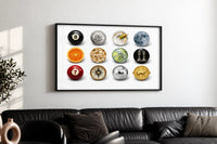 Martini and Disco Ball Circle Collage print in a black frame above a black leather sofa on a white wall