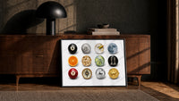 Martini and Disco Ball Circle Collage print in a black frame leaning against a walnut sideboard