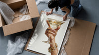 Martini Glass framed print being unpacked from protective bubble wrap and a box