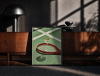 Black-framed Racket and Martini print on the floor in front of a dark wooden console