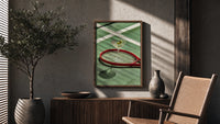 Racket and Martini poster framed above a fluted sideboard beside a potted tree