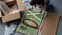 Racket and Martini framed print being unpacked from protective bubble wrap and a box