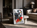 F1 driver celebrating beside race car print in a black frame leaning on a travertine table in a sunlit lounge