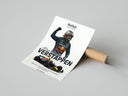 Woman unboxing Max Verstappen Red Bull Racing Victory poster from cardboard packaging on concrete floor
