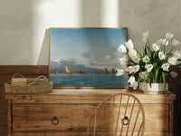Coastal seascape with sailing boats print in an oak frame on a farmhouse dresser beside white tulips