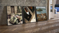 Mediterranean Escape Poster Set of 3 leaning on parquet beside a vintage loft door