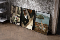 Mediterranean Escape Poster Set of 3 as black-framed prints leaning against a raw-plaster wall