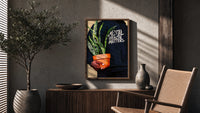 Mental Health Matters Hoodie and Potted Plant poster framed above a fluted sideboard beside a potted tree