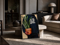 Mental Health Matters Hoodie and Potted Plant print on the floor, leaning against a travertine table