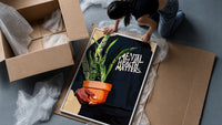Mental Health Matters Hoodie framed print being unpacked from protective bubble wrap and a box