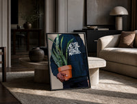 Mental Health Matters Potted Plant print on the floor, leaning against a travertine table