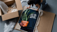 Mental Health Matters Potted Plant framed print being unpacked from protective bubble wrap and a box