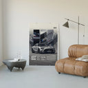 Mercedes-AMG GT Black Series poster framed above a tan leather living-room couch