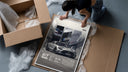 Mercedes-AMG GT Black Series framed print being unboxed from protective packaging