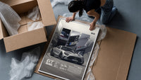 Mercedes-AMG GT Black Series framed print being unboxed from protective packaging
