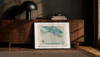 Vintage biplane flying in snow print in a black frame leaning against a walnut console in lamplight