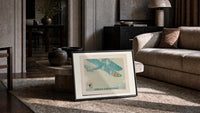 Vintage biplane flying in snow print in a slim black frame leaning on a travertine coffee table