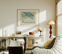 Vintage biplane flying in snow print in an oak frame above a mid-century book console with a vintage radio